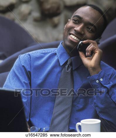 Businessman talking on cell phone View Large Photo Image Stock Photography - Businessman talking on cell phone. Fotosearch