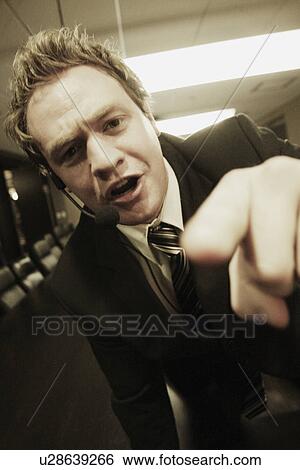 Stock Photograph - Businessman wearing a head set. Fotosearch