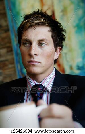 Businessman with a cup of coffee View Large Photo Image Picture - Businessman with a cup of coffee. Fotosearch