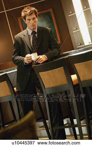 Businessman with cup of coffee View Large Photo Image Stock Photo - Businessman with cup of coffee. Fotosearch