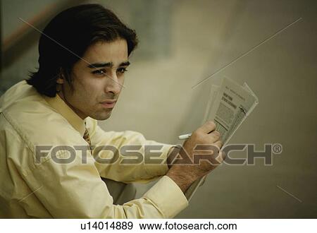 Businessman with newspaper View Large Photo Image Stock Photo - Businessman with newspaper. Fotosearch
