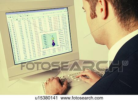 Businessman working on computer View Large Photo Image Stock Image - Businessman working on computer. Fotosearch