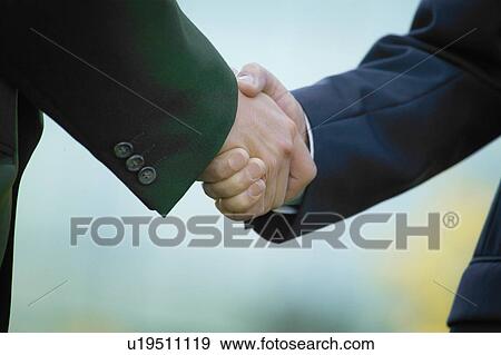 Stock Photo - Businessmen's handshake. Fotosearch