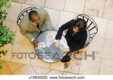 Businesspeople in a meeting View Large Photo Image Stock Image - Businesspeople in a meeting. Fotosearch