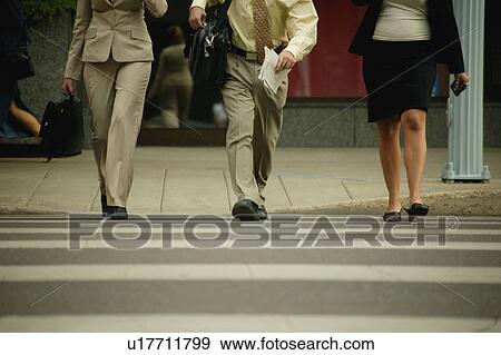 Stock Photo - Businesspeople on the go. Fotosearch
