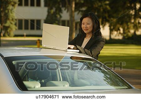Businesswoman on lap top computer View Large Photo Image Stock Image - Businesswoman on lap top computer. Fotosearch