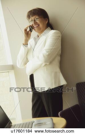 Picture - Businesswoman talking on phone. Fotosearch