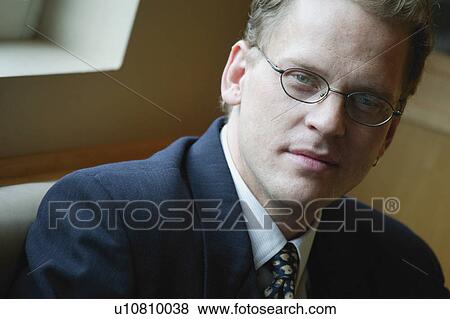 Caucasian businessman with classes looking confident View Large Photo Image Stock Photo - Caucasian businessman with classes looking confident. Fotosearch