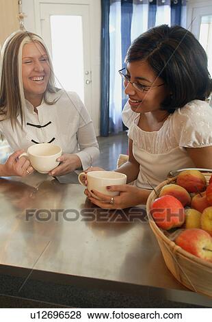 Chatting over coffee View Large Photo Image Stock Photo - Chatting over coffee. Fotosearch