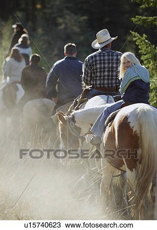 Stock Image - Child goes for a trail ride. Fotosearch