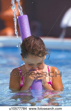 Child in a swimming pool View Large Photo Image Picture - Child in a swimming pool. Fotosearch