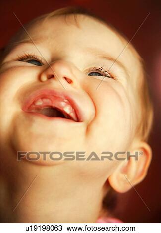 Stock Image - Child laughs. Fotosearch