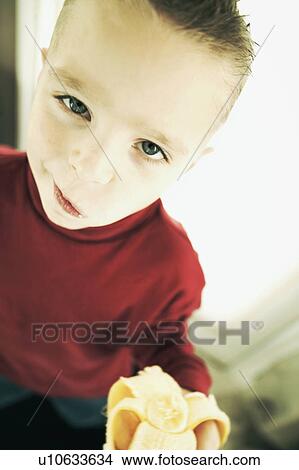 Child with a banana View Large Photo Image Picture - Child with a banana. Fotosearch