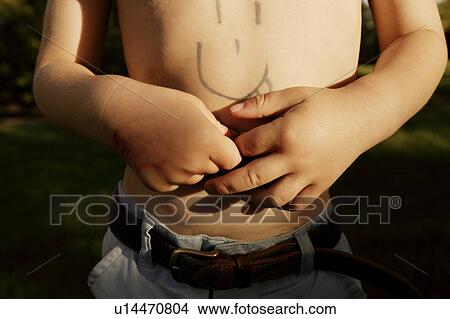 Child with drawing on his chest View Large Photo Image Picture - Child with drawing on his chest. Fotosearch