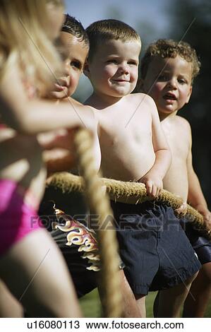 Children playing tug of war View Large Photo Image Stock Image - Children playing tug of war. Fotosearch