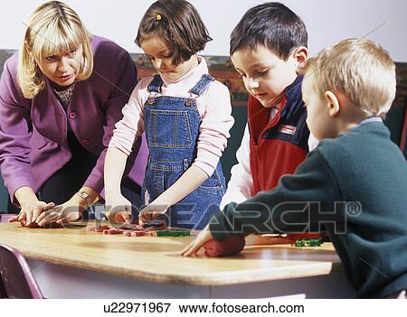 Children playing with supervisor View Large Photo Image Stock Photo - Children playing with supervisor. Fotosearch