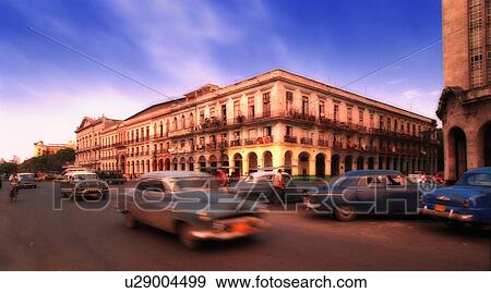 Stock Photo - Classic cars driving around. Fotosearch