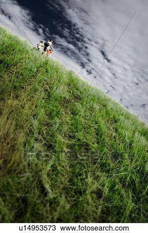 Stock Image - Climbing the hill. Fotosearch