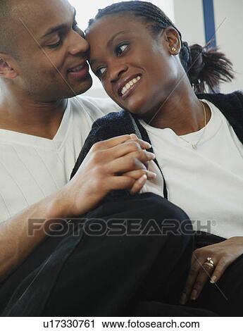 Close couple holding hands View Large Photo Image Stock Image - Close couple holding hands. Fotosearch