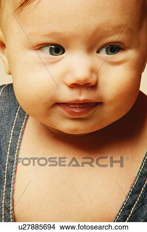 Picture - Closeup of baby's face. Fotosearch
