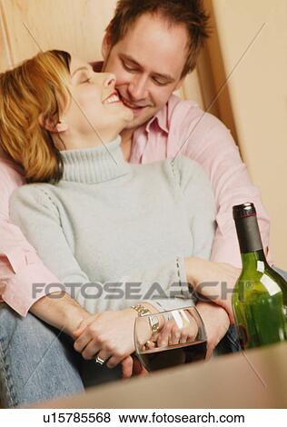 Stock Photo - Couple celebrates with wine. Fotosearch