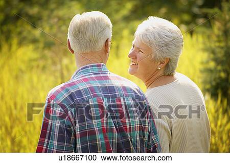 Couple enjoy a walk View Large Photo Image Stock Image - Couple enjoy a walk. Fotosearch
