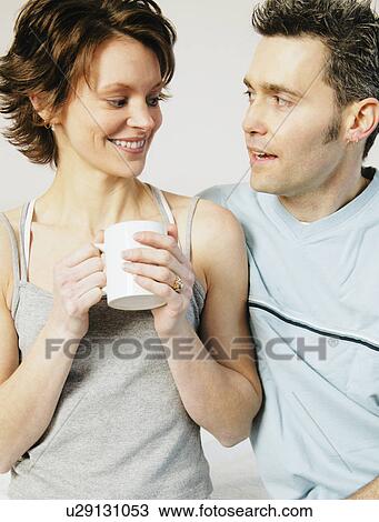 Stock Image - Couple enjoy morning company. Fotosearch