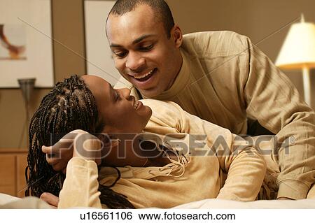 Couple enjoying each other's company View Large Photo Image Stock Photograph - Couple enjoying each other's company. Fotosearch
