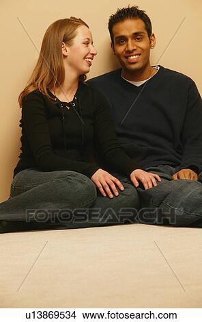 Picture - Couple enjoys company. Fotosearch