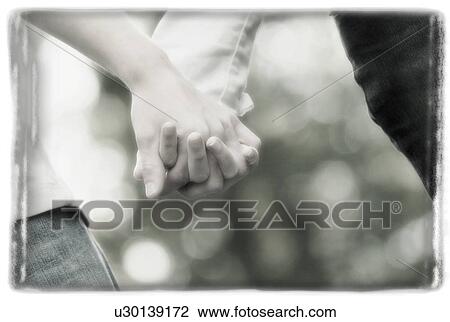 Stock Image - Couple holding hands. Fotosearch