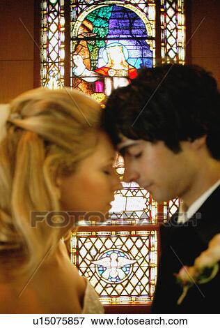Couple in a church View Large Photo Image Stock Photo - Couple in a church. Fotosearch