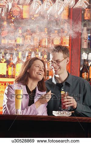 Stock Photo - Couple in a lounge. Fotosearch