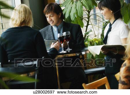 Couple in restaurant View Large Photo Image Stock Photo - Couple in restaurant. Fotosearch
