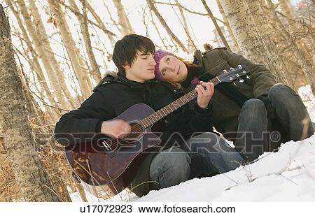 Stock Image - Couple listen to music. Fotosearch
