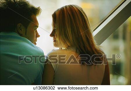 Stock Image - Couple looking at each other. Fotosearch