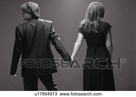 Couple looking in opposite directions View Large Photo Image Stock Image - Couple looking in opposite directions. Fotosearch