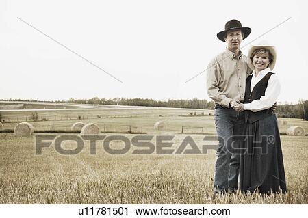 Stock Image - Couple on a farm. Fotosearch