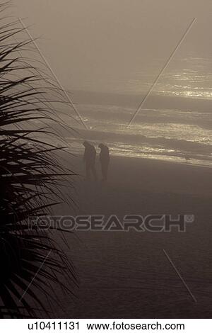 Couple on shore View Large Photo Image Stock Image - Couple on shore. Fotosearch