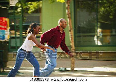 Couple on the run View Large Photo Image Stock Photo - Couple on the run. Fotosearch