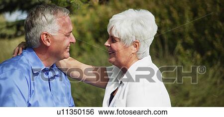 Stock Photograph - Couple shares an embrace. Fotosearch