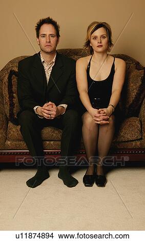 Picture - Couple sitting side by side. Fotosearch