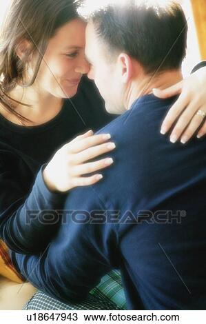 Couple snuggling View Large Photo Image Stock Image - Couple snuggling. Fotosearch