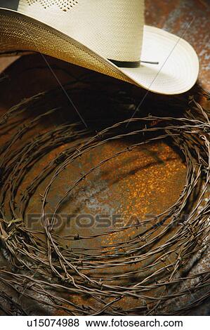 Stock Photo - Cowboy hat and barbed wire still life. Fotosearch