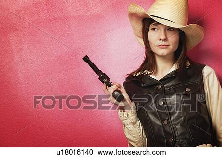 Cowgirl with gun View Large Photo Image Stock Image - Cowgirl with gun. Fotosearch
