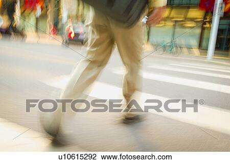 Stock Image - Crossing the street. Fotosearch