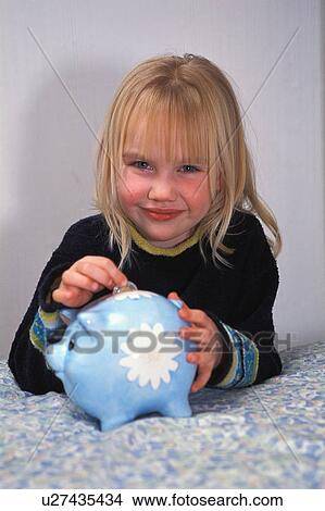 Deposit in piggy bank View Large Photo Image Picture - Deposit in piggy bank. Fotosearch