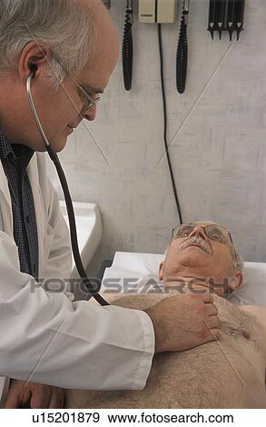 Stock Photo - Doctor examining patient. Fotosearch