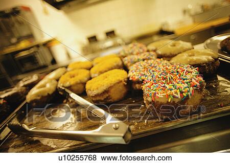 Donuts in a cafeteria View Large Photo Image Stock Photo - Donuts in a cafeteria. Fotosearch