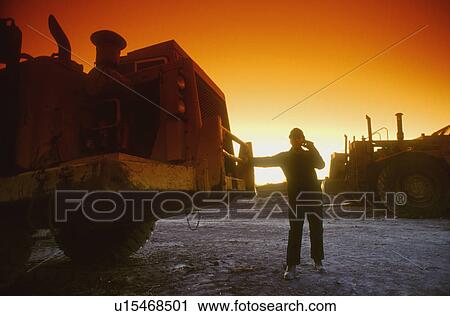 Early morning worker and vehicle View Large Photo Image Stock Image - Early morning worker and vehicle. Fotosearch