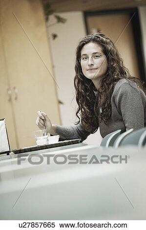 Stock Photography - Eating in a cafeteria. Fotosearch